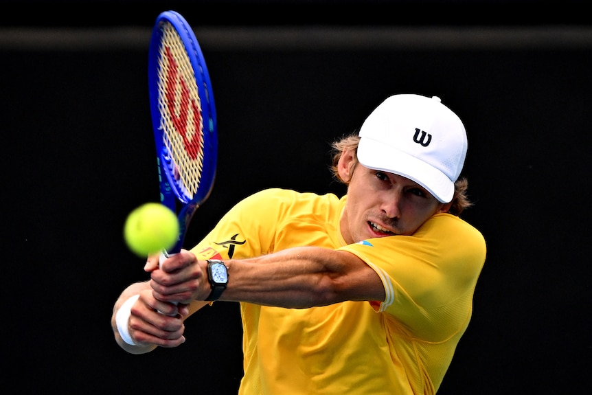 Alex de Minaur of Australia hits a backhand during a Davis Cup tie against Poland.