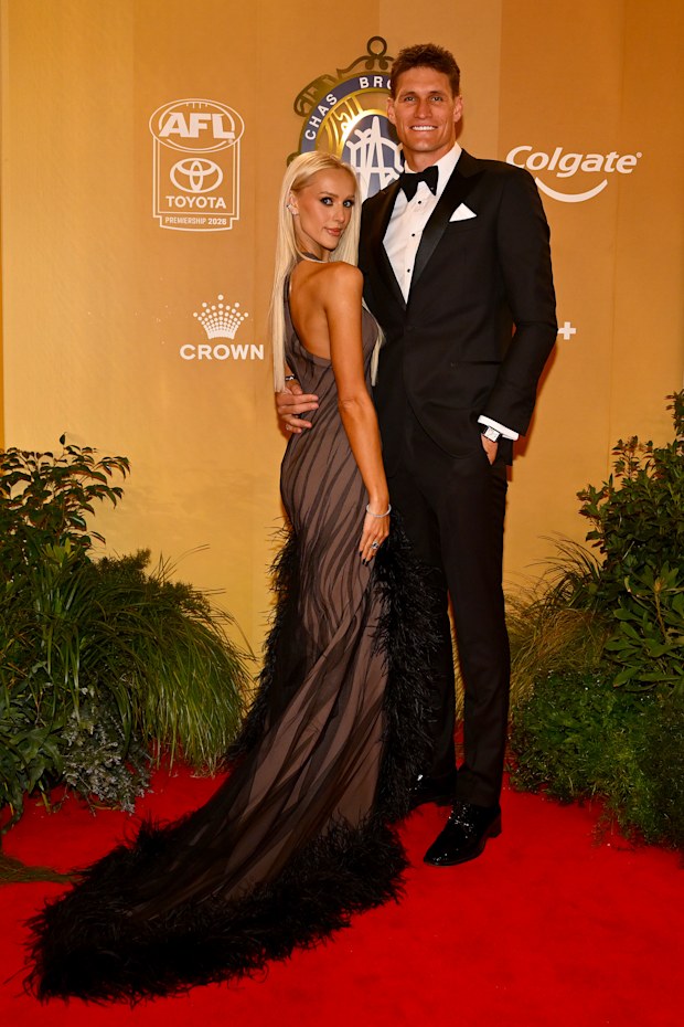 Rory Lobb of the Western Bulldogs and wife Lexi Lobb arrive ahead of the 2026 Brownlow Medal at Crown Palladium on September 21, 2026 in Melbourne, Australia.