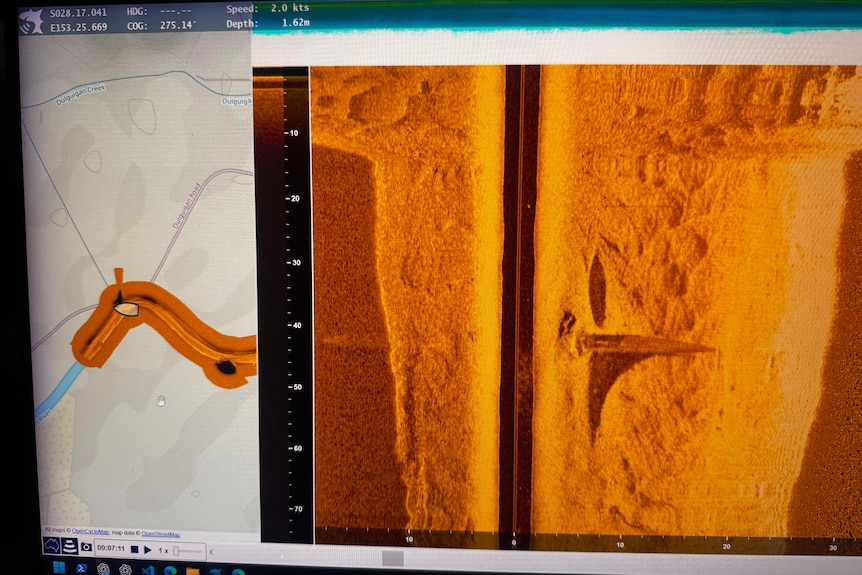 orange sonar image showing outline of an object on the river floor.