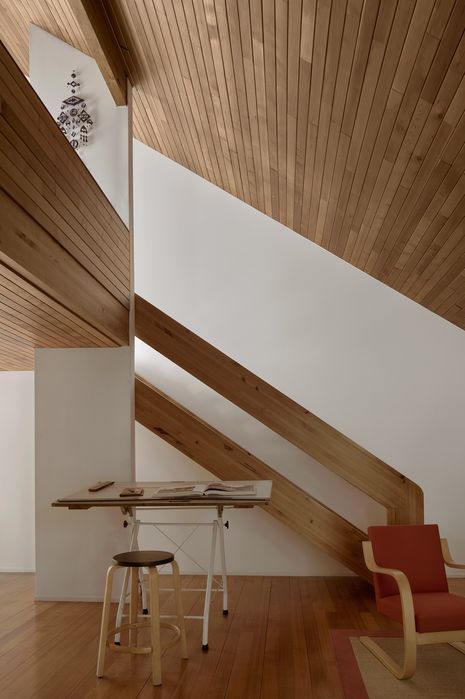 The play of light and shadow throughout the shifting floor plan, and the contrast of white and timber internally, create a series of captivating spaces.