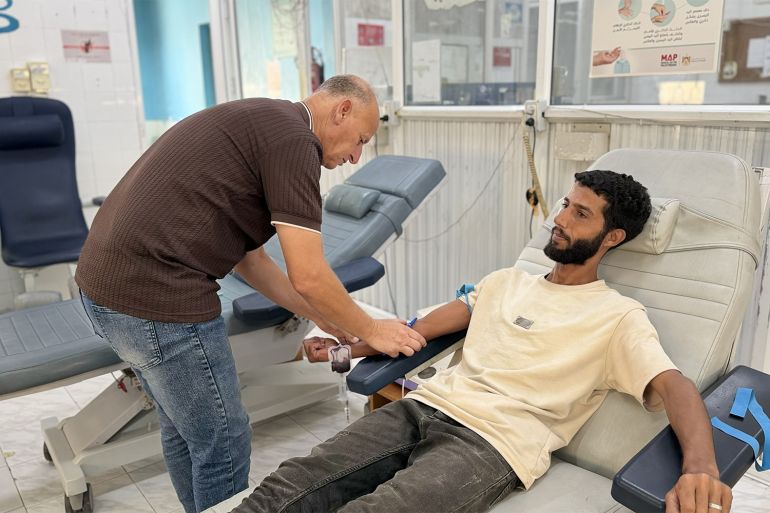 Blood is drawn from a patient for testing as Gaza’s medical staff try to treat patients with limited healthcare resources