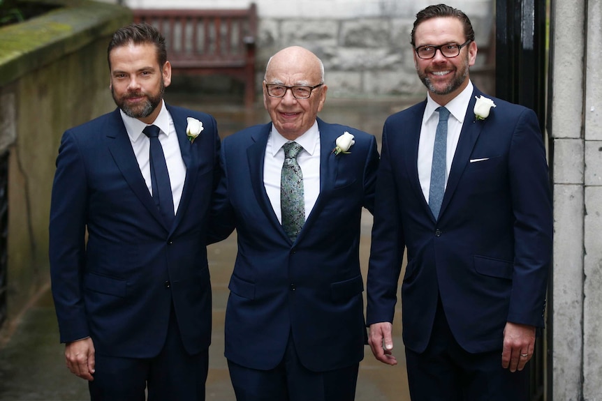 Lachlan and Rupert Murdoch both wear navy suits