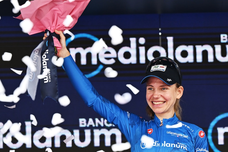 Sarah Gigante holds up a bouquet of flowers