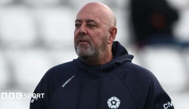Darren Lehmann wearing a blue Northants hooded top