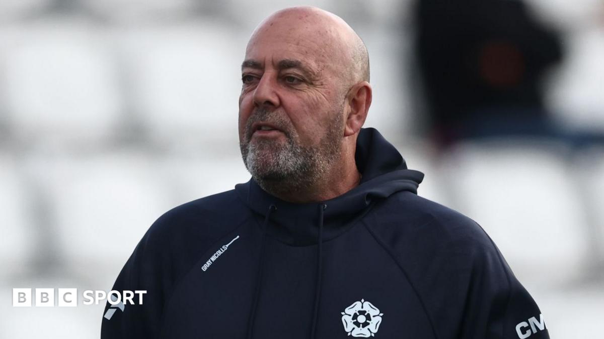 Darren Lehmann wearing a blue Northants hooded top