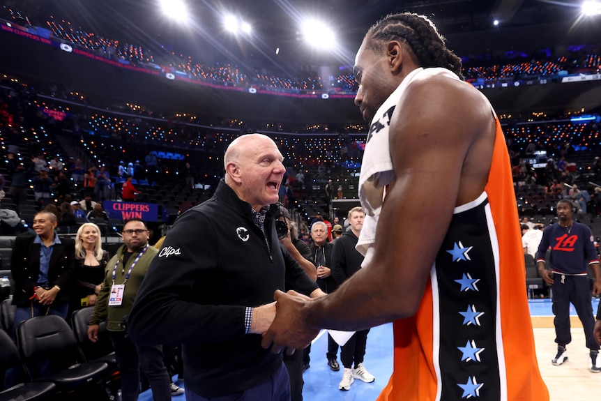 Steve Ballmer and Kawhi Leonard shake hands