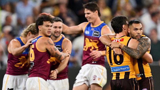 Jarman Impey (right) is consoled by Hawthorn teammate Massimo D’Ambrosio as the Hawks succumb to the Brisbane Lions in the preliminary final at the MCG.