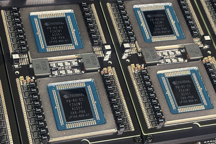 Four computer chips with the Nvidia brand logo.