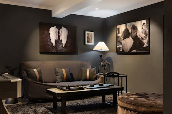Photos on the walls in the listing show Cooper and his wife, Elizabeth Adams.