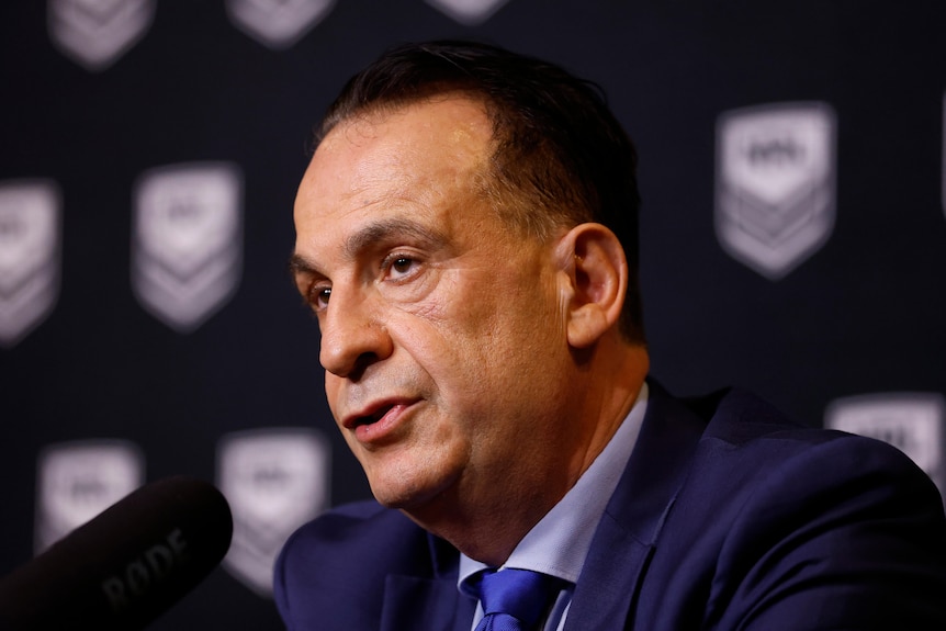 Peter V'landys in a suit at a press conference