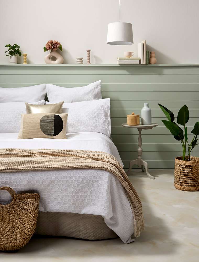 A contrast pattern and depth of colour bring rich warmth to this room that still feels inspired by the coast. Project by Annick Larkin. Mural Hannah Tapner. Photo / Bryce Carleton