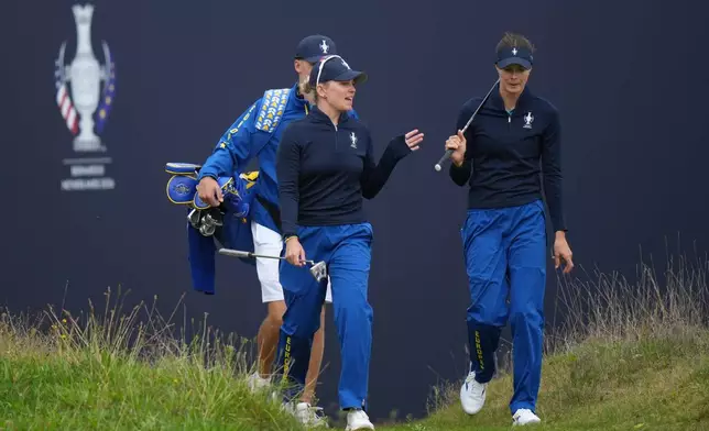 Nanna Koerstz Madsen of Europe, left and Esther Henseleit of Europe walk onto the 15th green during a practice round for the Solheim Cup at the Bernardus Golf course in Vught, Netherlands, Wednesday, Sept. 9, 2026. (AP Photo/Alastair Grant)