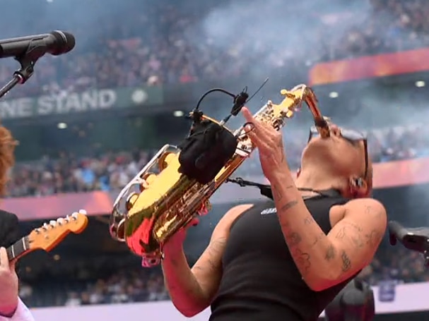G Flip plays the saxaphone
