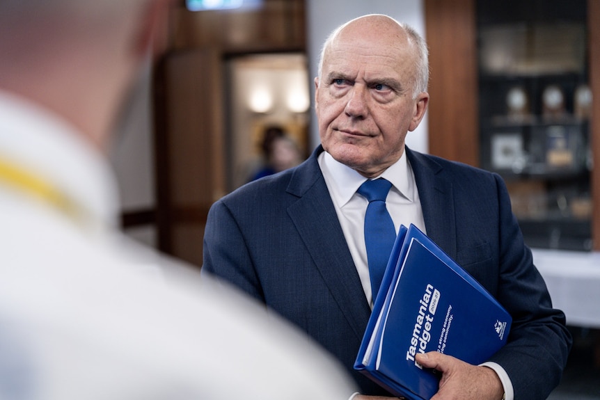 Treasurer Eric Abetz holds the Tasmanian Budget book