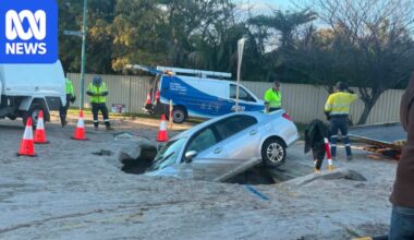 Car falls into sinkhole after burst water main in Canning Vale