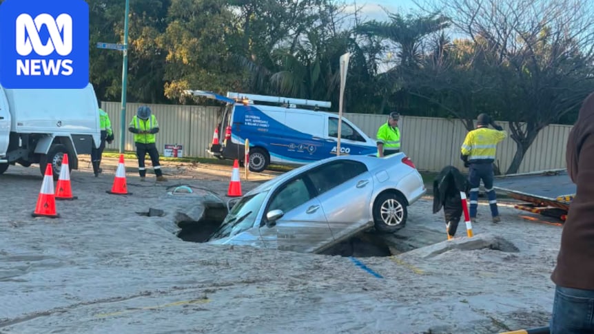 Car falls into sinkhole after burst water main in Canning Vale