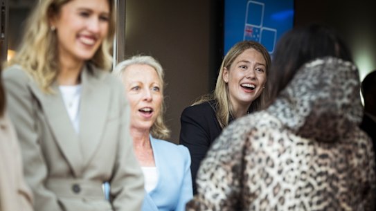 Amelia Hamer (right) and Jacqueline Blackwell (light blue jacket) greet Liberal Party members at Caulfield Racetrack for the Victorian Liberal party Preselection for Malvern.