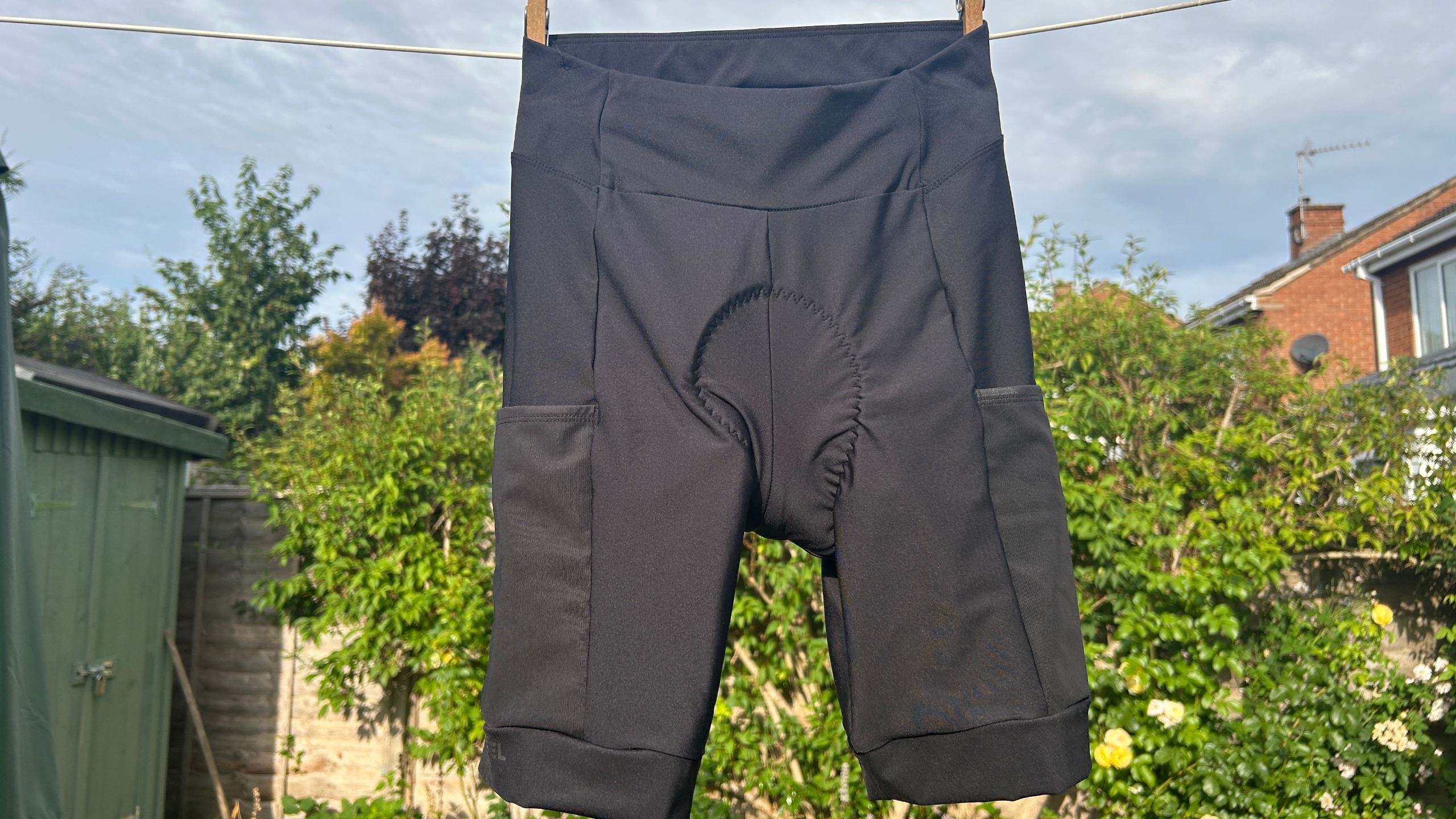 Images of tester the Van Rysel Menstrual bib less shorts hanging up on a washing line