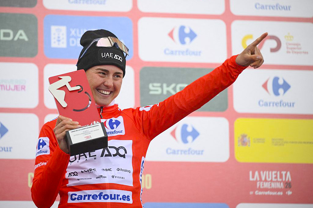 Paula Blasi celebrates her 2026 La Vuelta Femenina title in the red jersey on the final podium