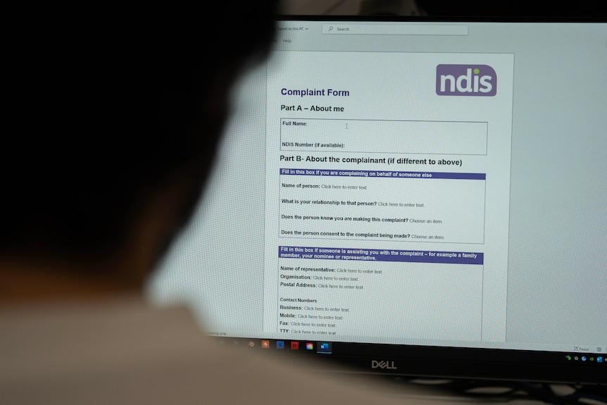 Woman looks at the NDIS complaints form online