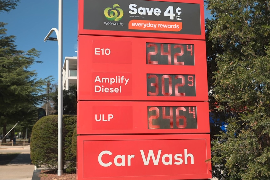 Fuel prices on a sign outside a petrol station, showing 242c per litre for E10.