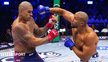 Alex Pereira is punched by Ciryl Gane in their UFC fight