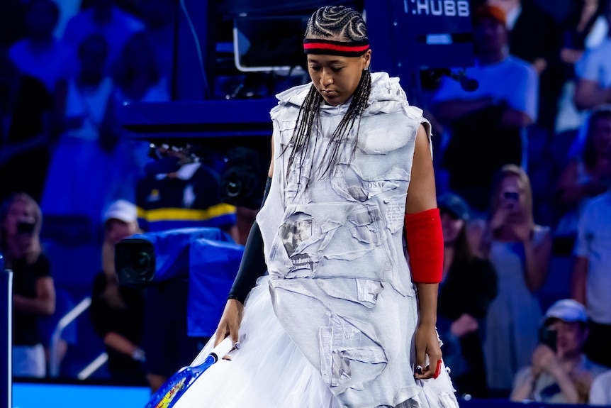 Naomi Osaka of Japan walks onto the court at US Open.