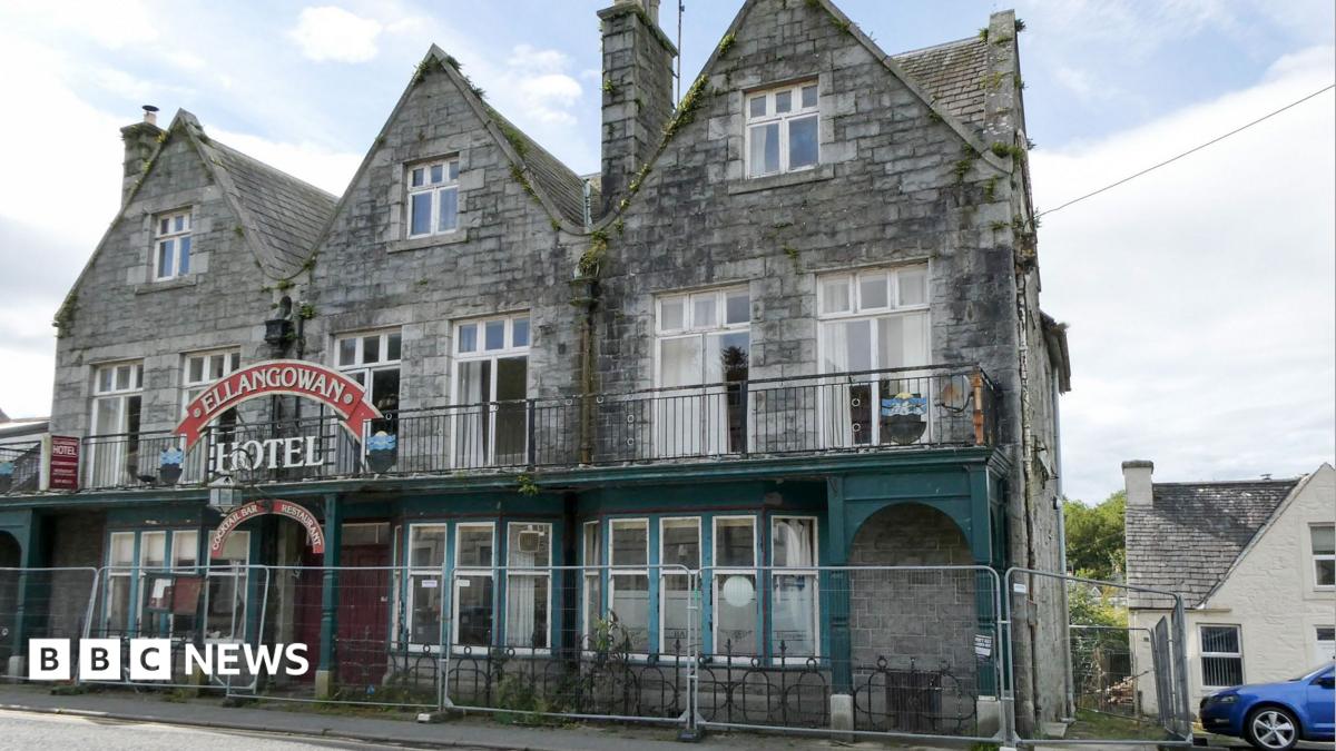 A run down hotel with barriers outside it with the Ellangowan Hotel sign above the door.