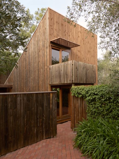 The front wedge projects towards the street as a marker for the textured geometric beauty beyond.