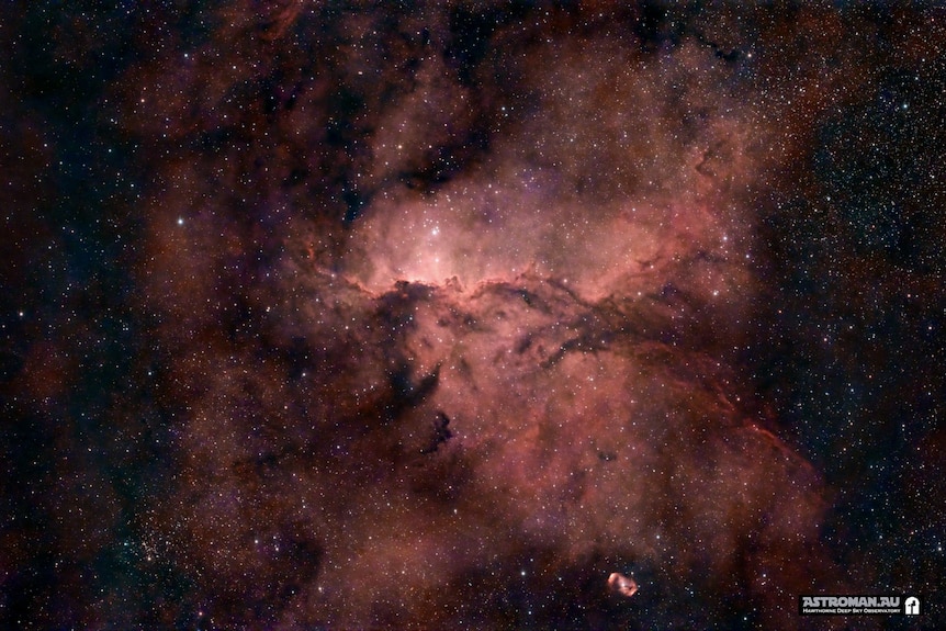 A red nebula and stars.