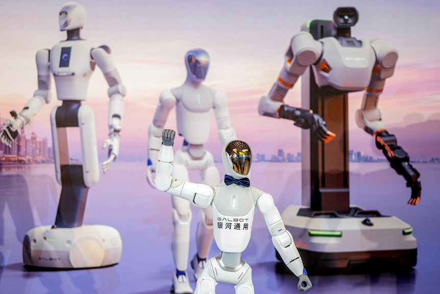 Humanoid robots demonstrating their capabilities at a showing in Hong Kong.