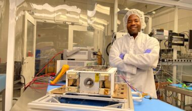 An Album of photos showing NASA engineers and technicians in white protective clean room suits working on a small, rectangular spacecraft module. They are shown inspecting the hardware on a laboratory workbench, wrapping it in silver foil, and loading it into a large, metallic vacuum chamber at NASA's Marshall Space Flight Center