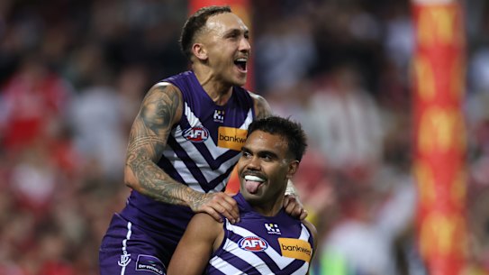 Shai Bolton and Isaiah Dudley celebrate a crucial goal in their thrilling win over Sydney.