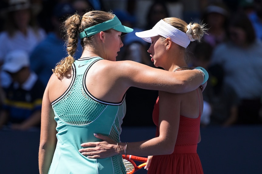 Mirra Andreeva puts her arm around Anastasia Potapova at the US Open.