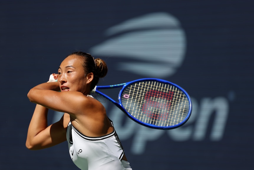 Qinwen Zheng hits a backhand at the US Open.