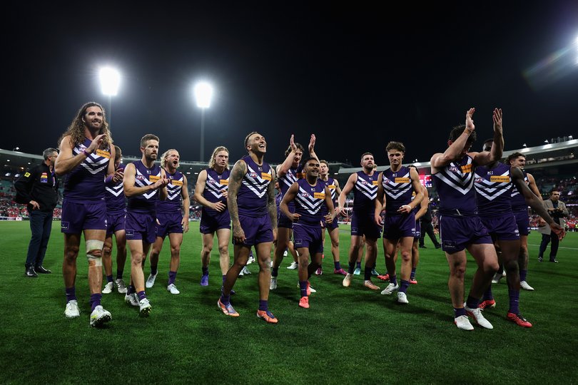 Dockers and team mates leave the field after winning the AFL Preliminary Final match between the Sydney Swans and Fremantle Dockers.