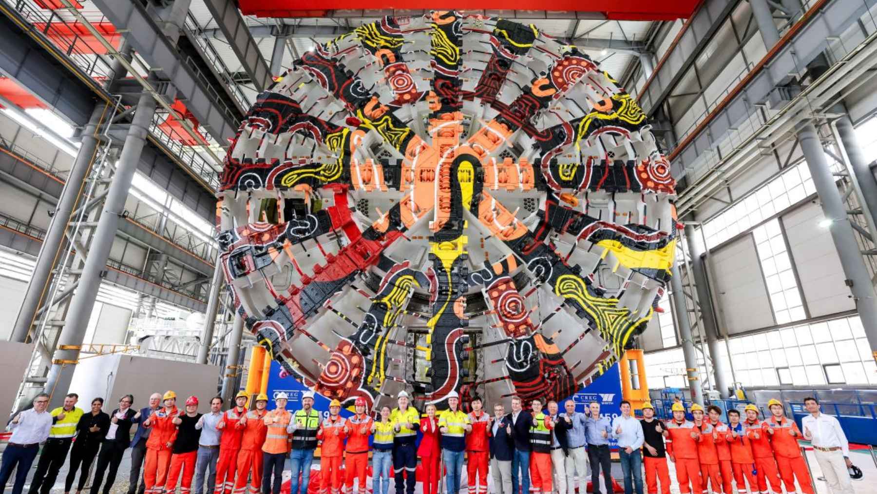 A boring machine underground cutterhead pressed against the tunnel face inside a Sydney sandstone launch chamber