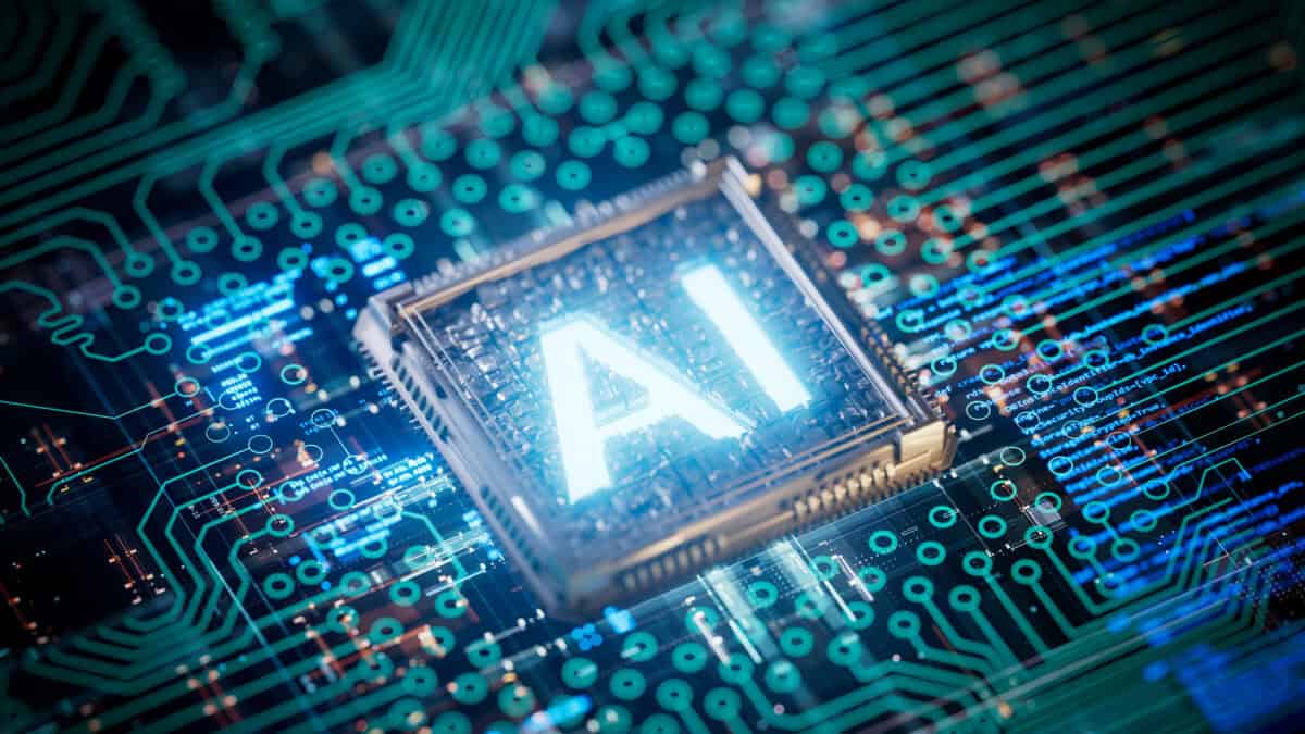 Glowing AI text in the middle of a semiconductor chip.