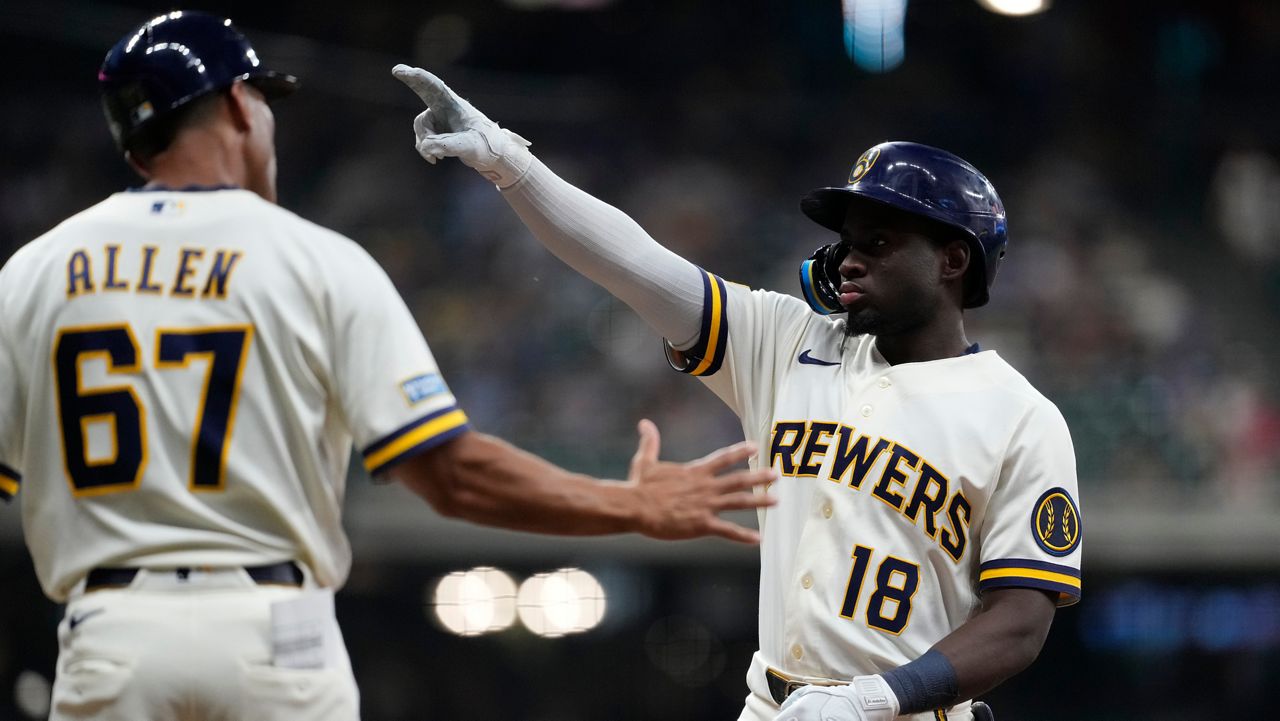 Milwaukee Brewers' Luis Lara (18) gestures after hitting an RBI single during the fifth inning of a baseball game against the Pittsburgh Pirates, Tuesday, Aug. 4, 2026, in Milwaukee.