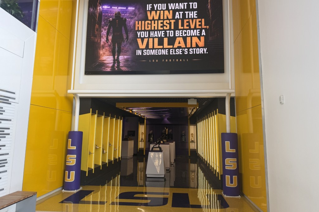 A quote hangs above a trophy display room near the entrance of the LSU Football Operations Center Monday, Aug. 31, 2026, in Baton Rouge, La.
