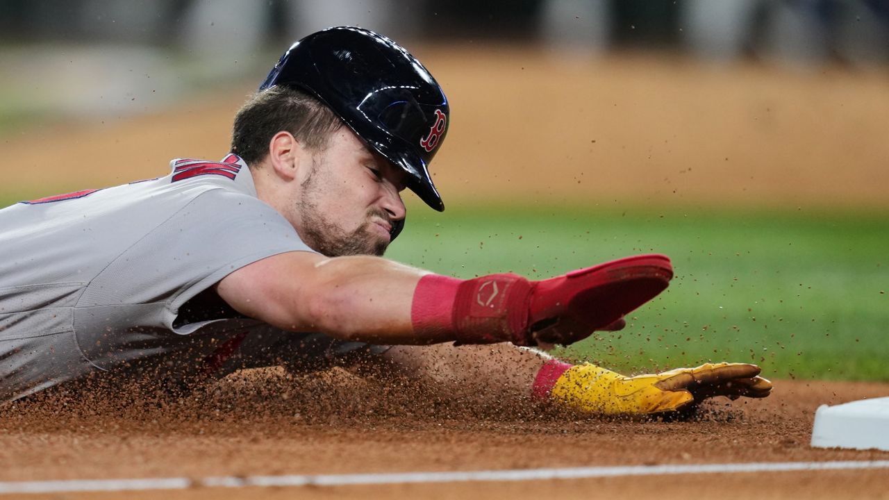 Boston Red Sox's Caleb Durbin advances to third on a single by Trevor Story in the fifth inning of a baseball game against the Texas Rangers Wednesday, Sept. 16, 2026, in Arlington, Texas. (AP Photo/Tony Gutierrez)