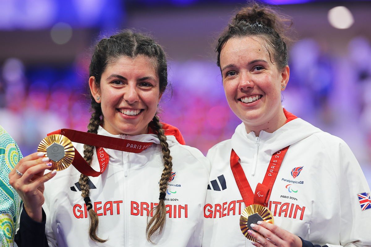 Lizzi Jordan with pilot Danni Khan at the Paris 2024 Paralympic Games where they won gold in the women's tandem 1km time trial.