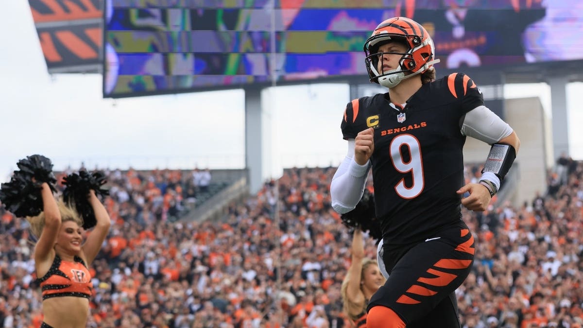 Cincinnati Bengals QB Joe Burrow runs out to the field before a game vs. the Arizona Cardinals at Paycor Stadium in Ohio.