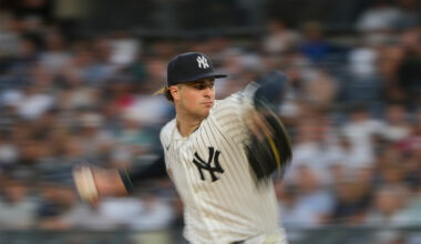 Cam Schlittler shown in the middle of a pitching wind-up, about to release the ball, on the mound.