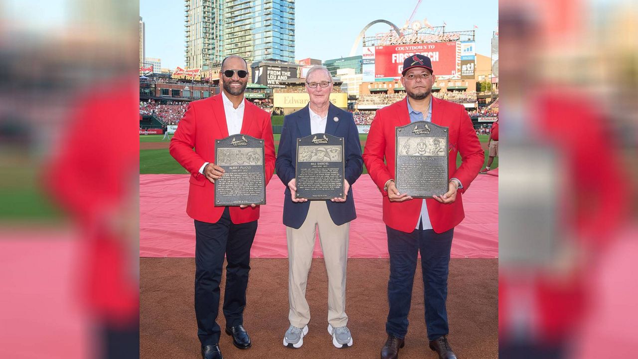 Former Cardinals first baseman Albert Pujols (left) and former Cardinals Catcher Yadier Molina (right) were inducted into the St. Louis Cardinals Hall of Fame Saturday at Busch Stadium. John Sherdel (center) spoke on behalf of his late grandfather, pitcher Bill Sherdel, who was also put into the team's Hall. (Courtesy: St. Louis Cardinals)