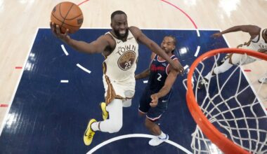 Jan 5, 2026; Inglewood, California, USA; Golden State Warriors forward Draymond Green (23) shoots the ball against LA Clippers forward Kawhi Leonard (2) in the first half at Intuit Dome. Mandatory Credit: Kirby Lee-Imagn Images