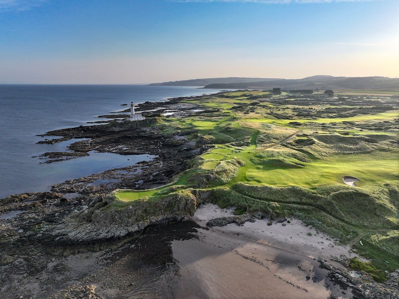 An aerial view of the par 3, ninth hole with the lighthouse and the green on the par 4, eighth hole at Trump Turnberry. Photograph: David Cannon/Getty