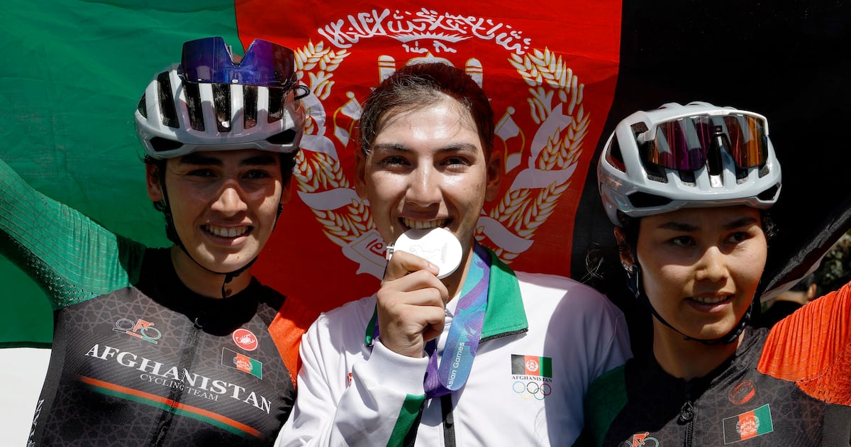 Afghan cyclist who dressed as a man to avoid Taliban wins silver medal at Asian Games