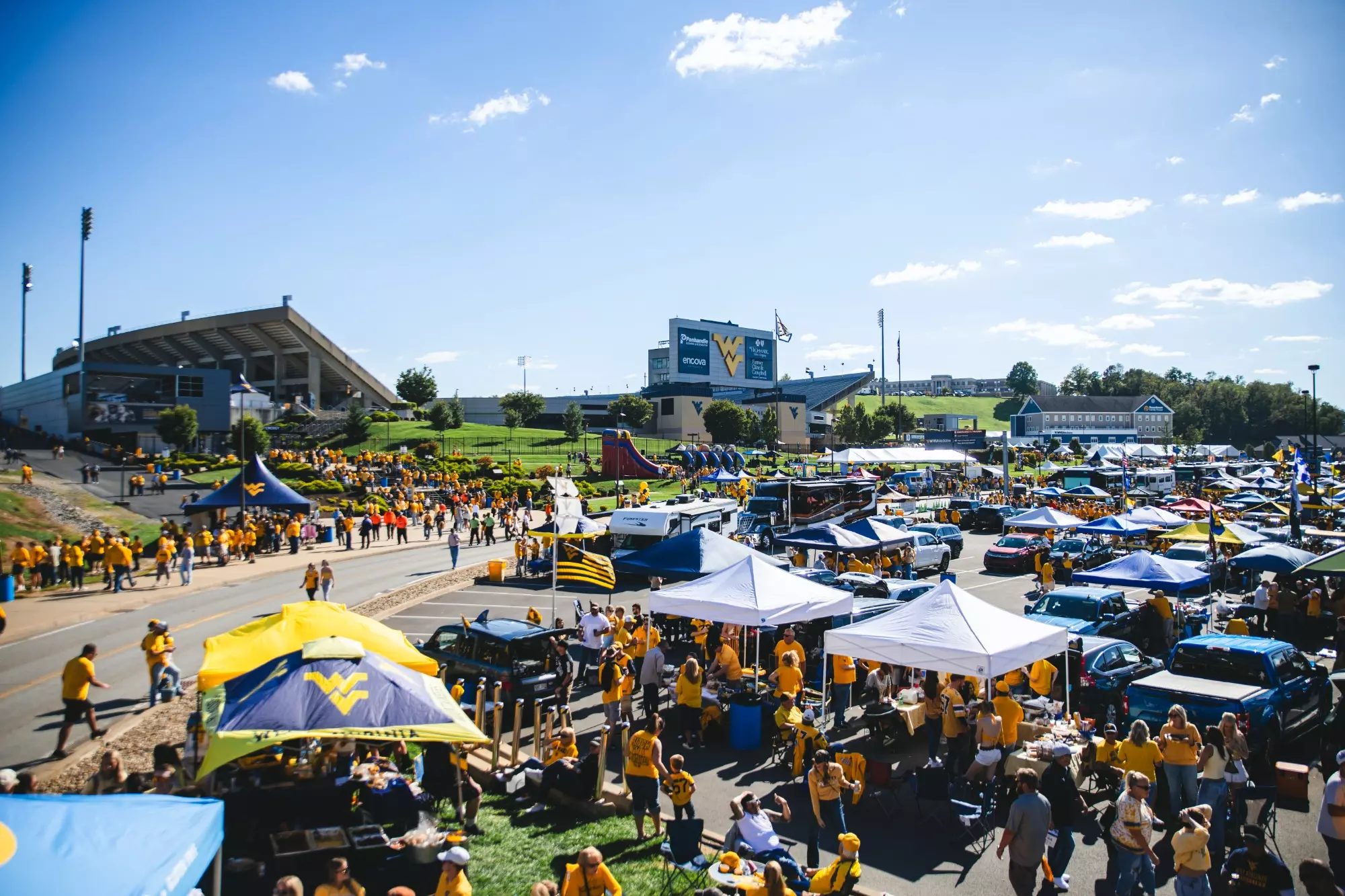 Fans tailgate before West Virginia's game against Oklahoma State on Sept. 26, 2026, in Morgantown, W.Va.