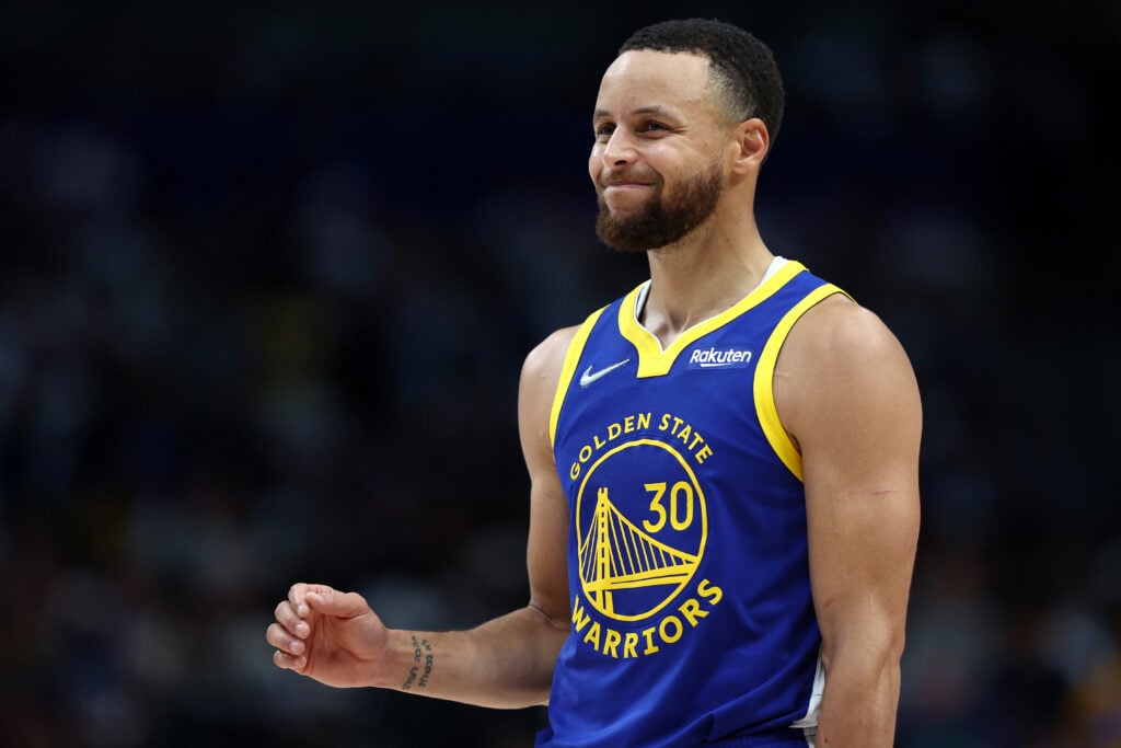 Stephen Curry #30 of the Golden State Warriors reacts to a play during the second quarter against the Dallas Mavericks in Game Four of the 2022 NBA Playoffs Western Conference Finals at American Airlines Center.